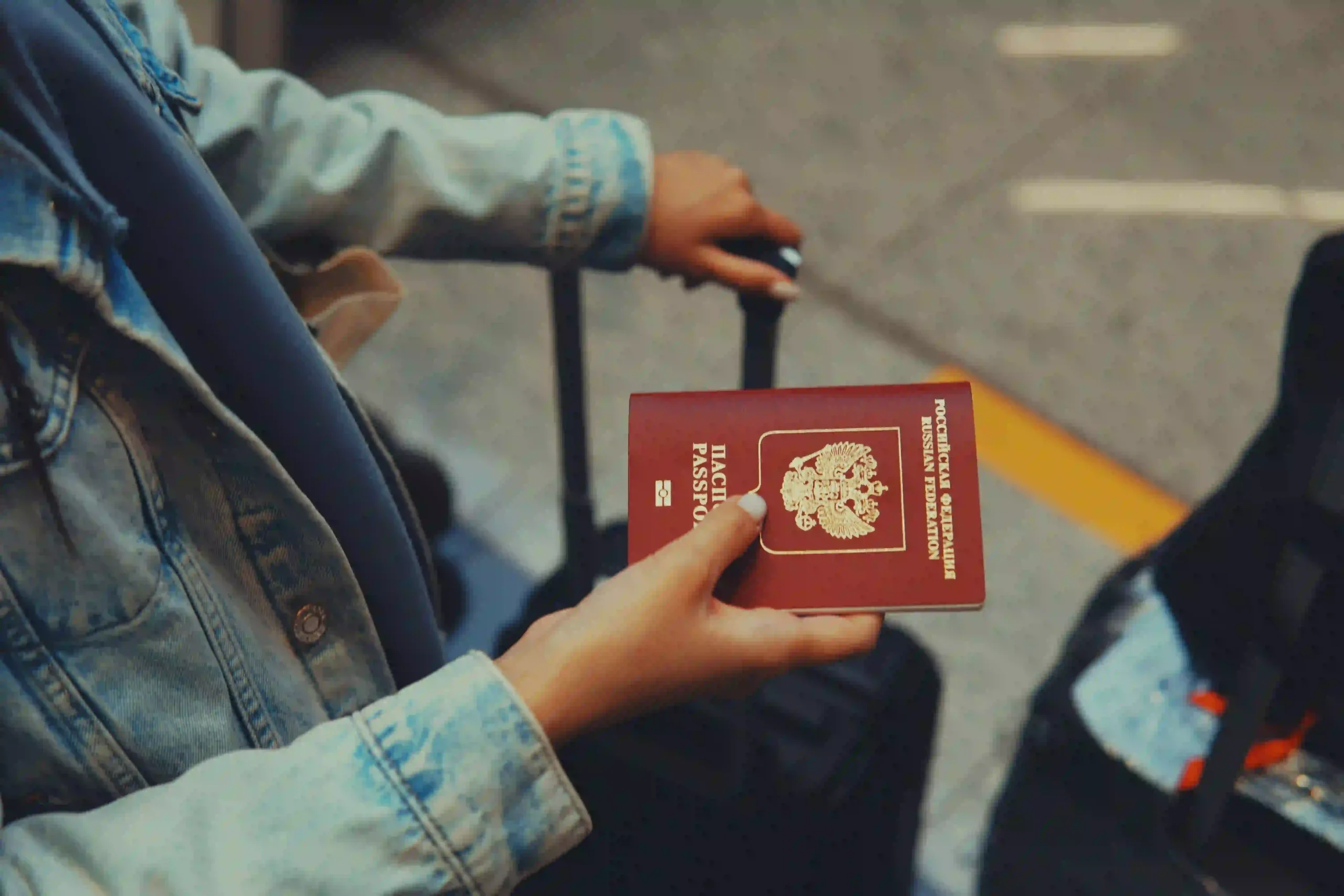A foreign traveler with passport in hand, preparing for visa service | FISC